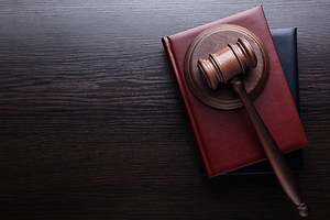 Gavel stacked on books